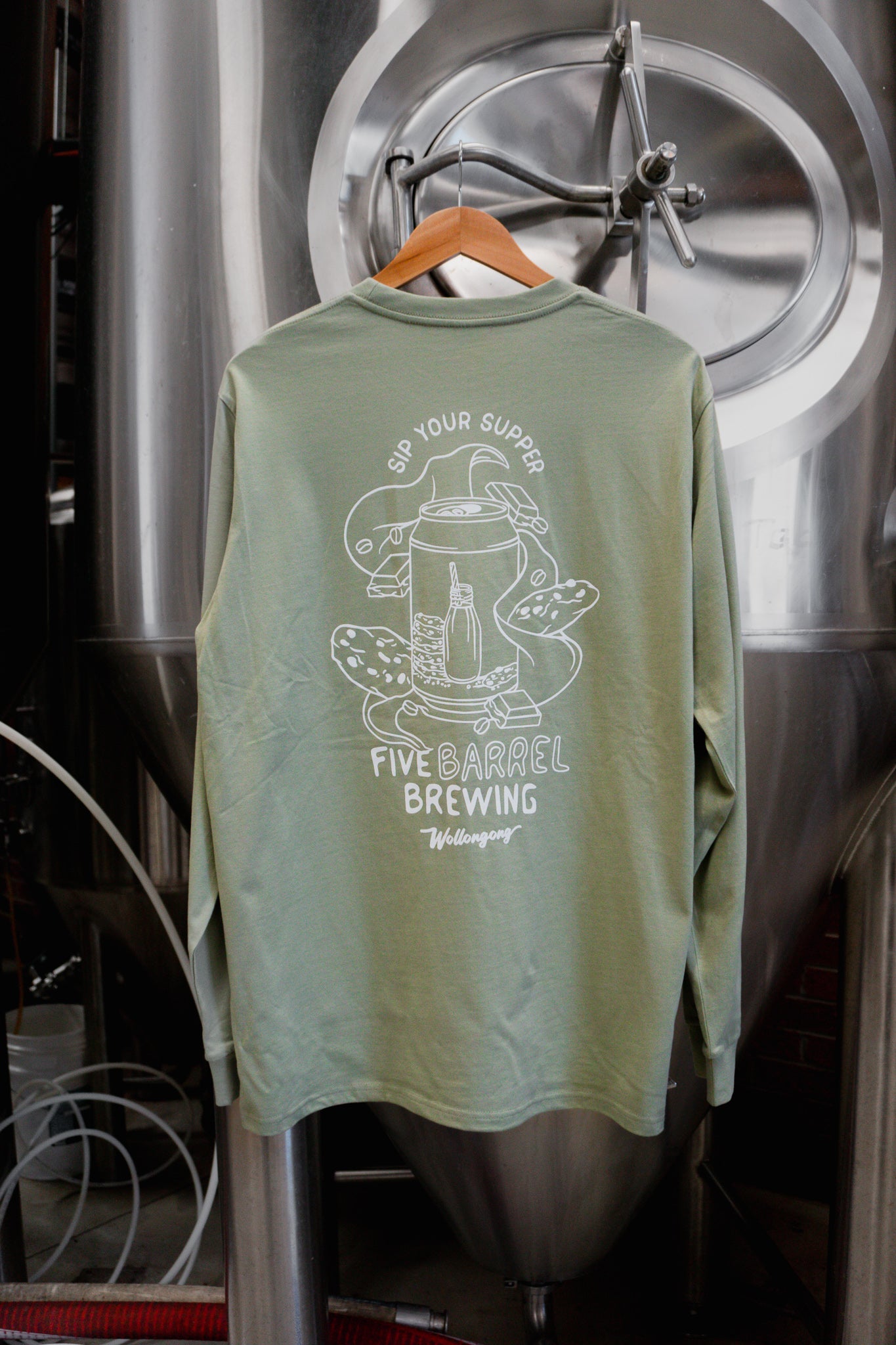 Pistachio coloured long sleeve t-shirt that says "sip your supper" with Night Cap Milk Stout Image and Five Barrel Brewing Logo